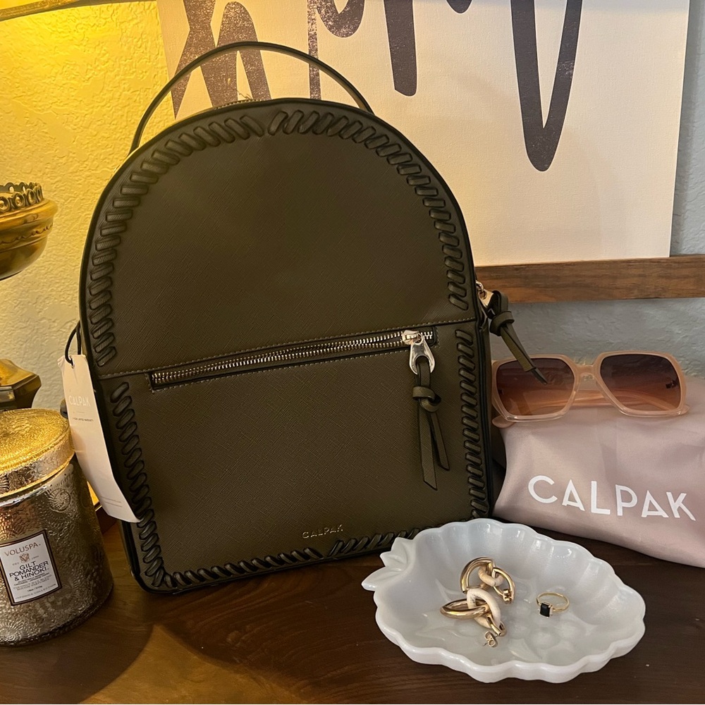 Calpak Dark GreenBackpack with fun stitching.